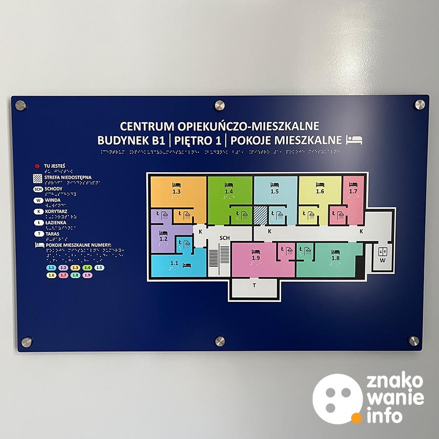 Tyfloplan z alfabetem Braille'a montowany przy pomocy kołków dystansowych Tyfloplan z alfabetem Braille'a montowany przy pomocy kołków dystansowych